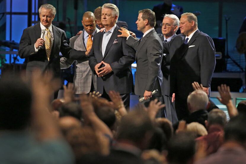 Mike Buster (left), executive pastor at Prestonwood Baptist Church, has filed a lawsuit...