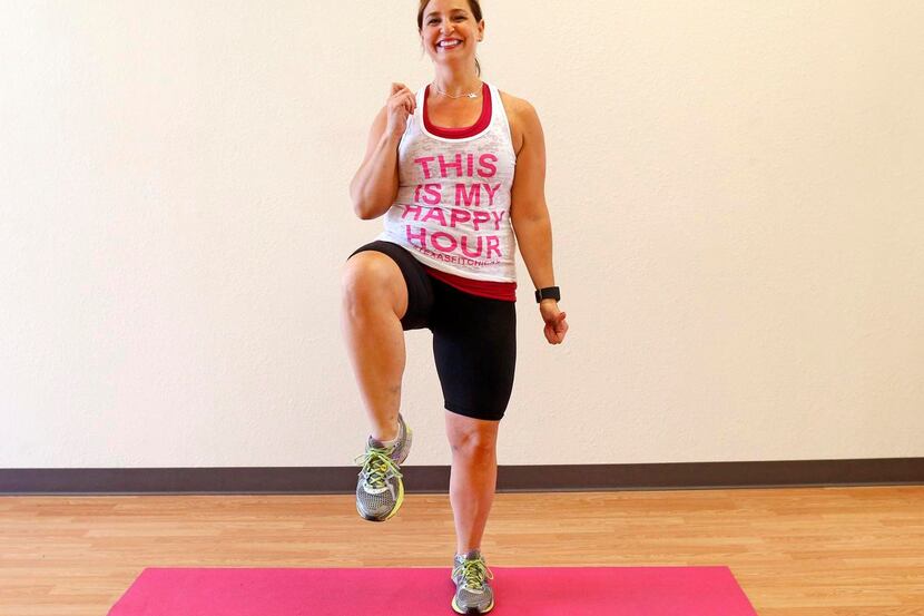 Personal trainer Ellen Cardona  warms up by doing  high knees (60 reps) during a...