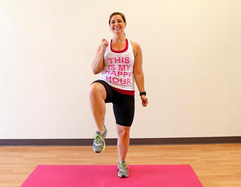 Personal trainer Ellen Cardona  warms up by doing  high knees (60 reps) during a...