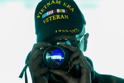 Herman Hardy, 72 from Pittsburgh, gets his cameras ready before boarding Southwest flight...