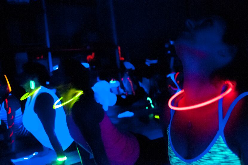 Yogis enjoy a Glowga Warehouse Party flow in 2013.