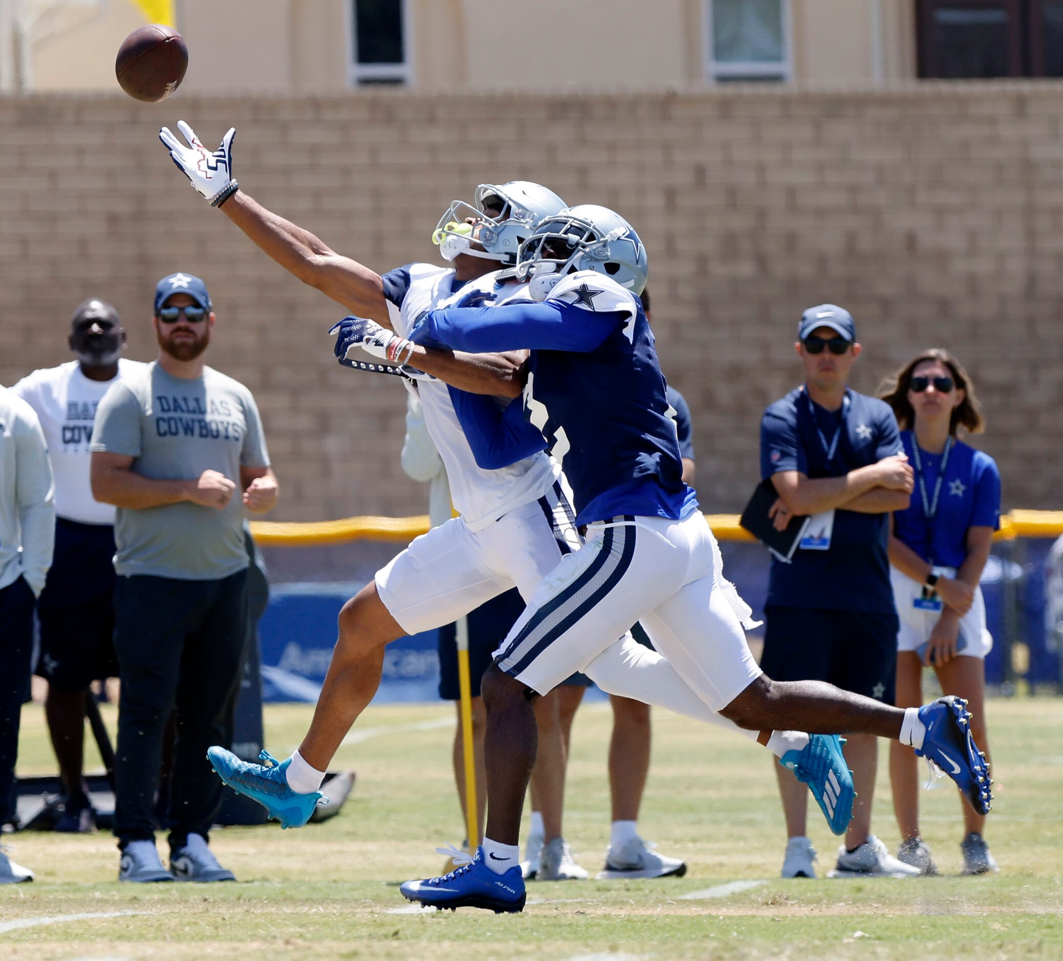 Dallas Cowboys wide receiver Jalen Tolbert (18) reaches in vein for an overthrown pass as...