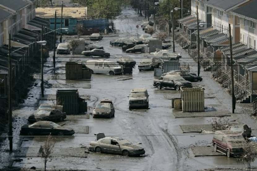 Cars are strewn in the mud in New Orleans' Lower Ninth Ward on Sept. 15, 2005.