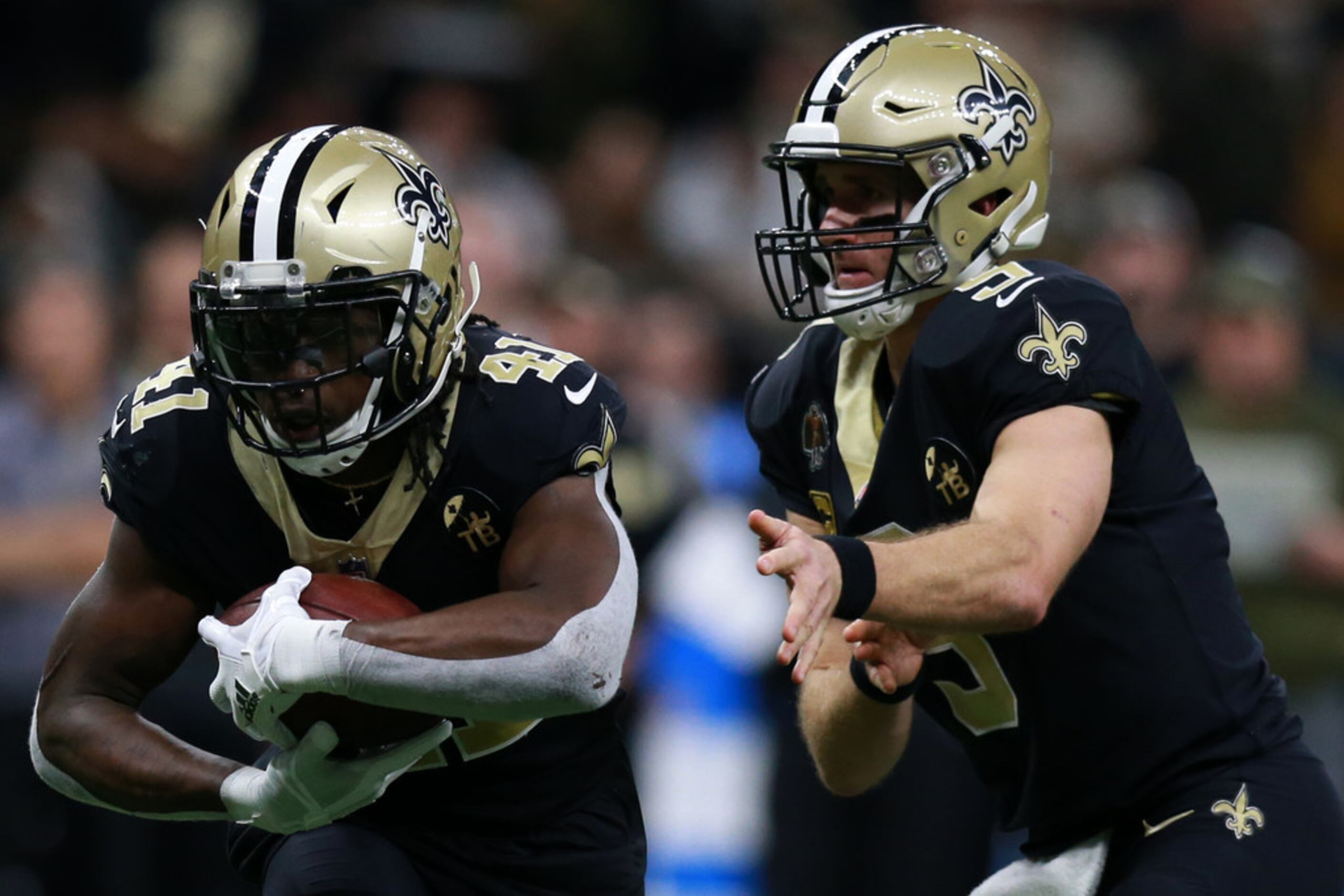 Alvin Kamara of the New Orleans Saints runs with the ball against