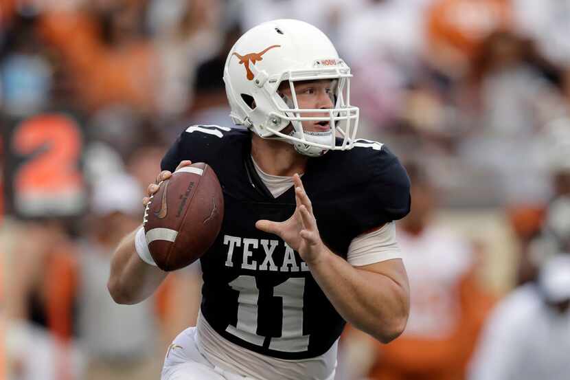 Texas Longhorns quarterback Sam Ehlinger (11) looks to throw during the team's Orange-White...