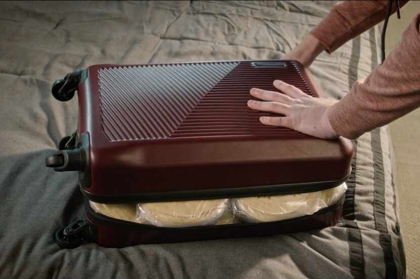 Look closely inside the bulging suitcase in this teaser photo for H-E-B's Super Bowl LVII...