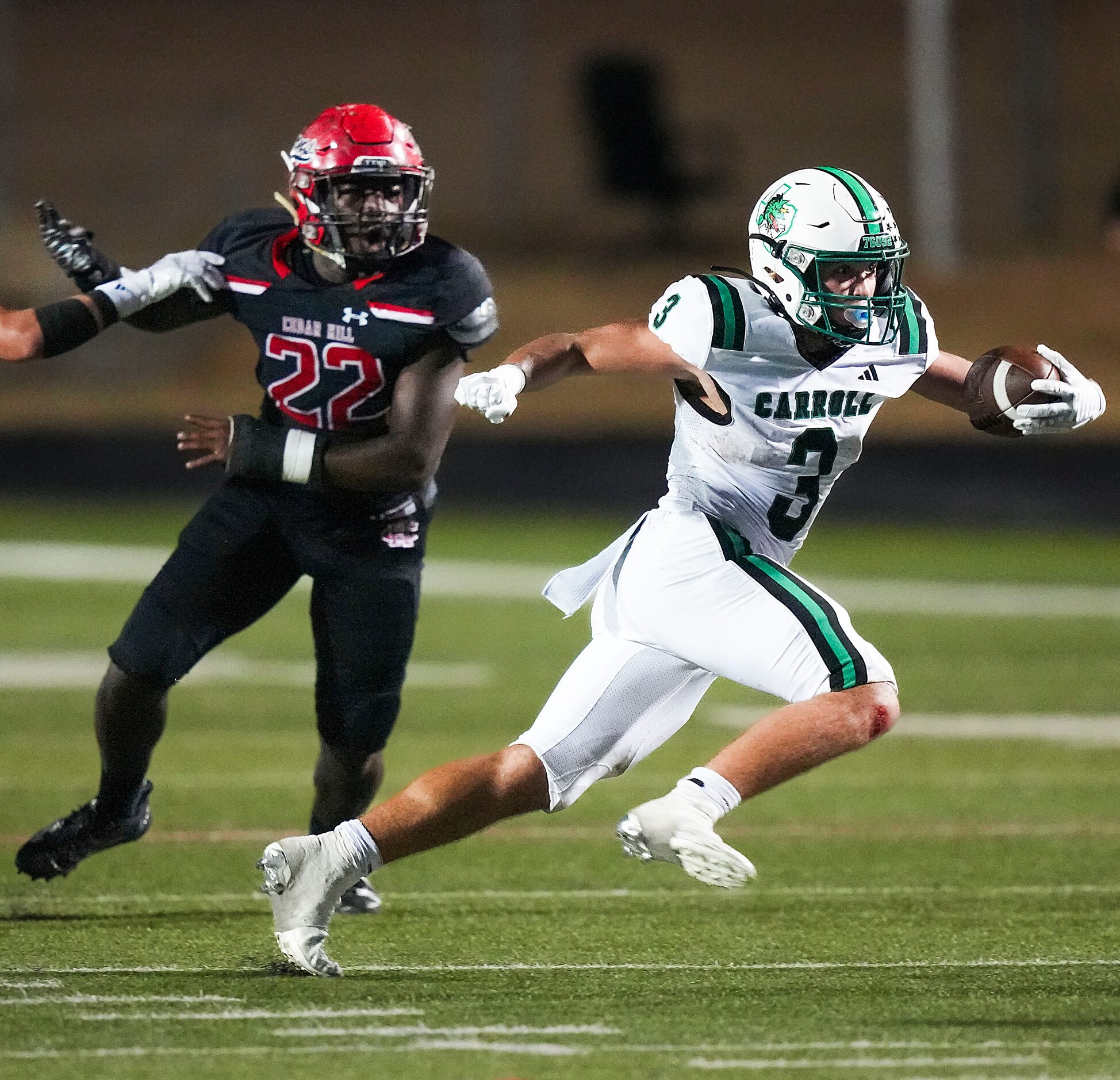 Southlake Carroll running back Davis Penn (3) gets past Cedar Hill linebacker Kenric Strong...