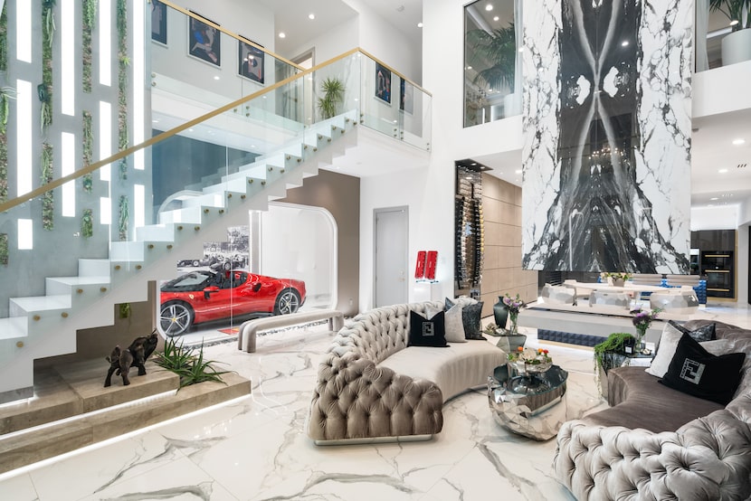 It's safe to say that the Ferrari-viewing window is the focal point of the striking living...