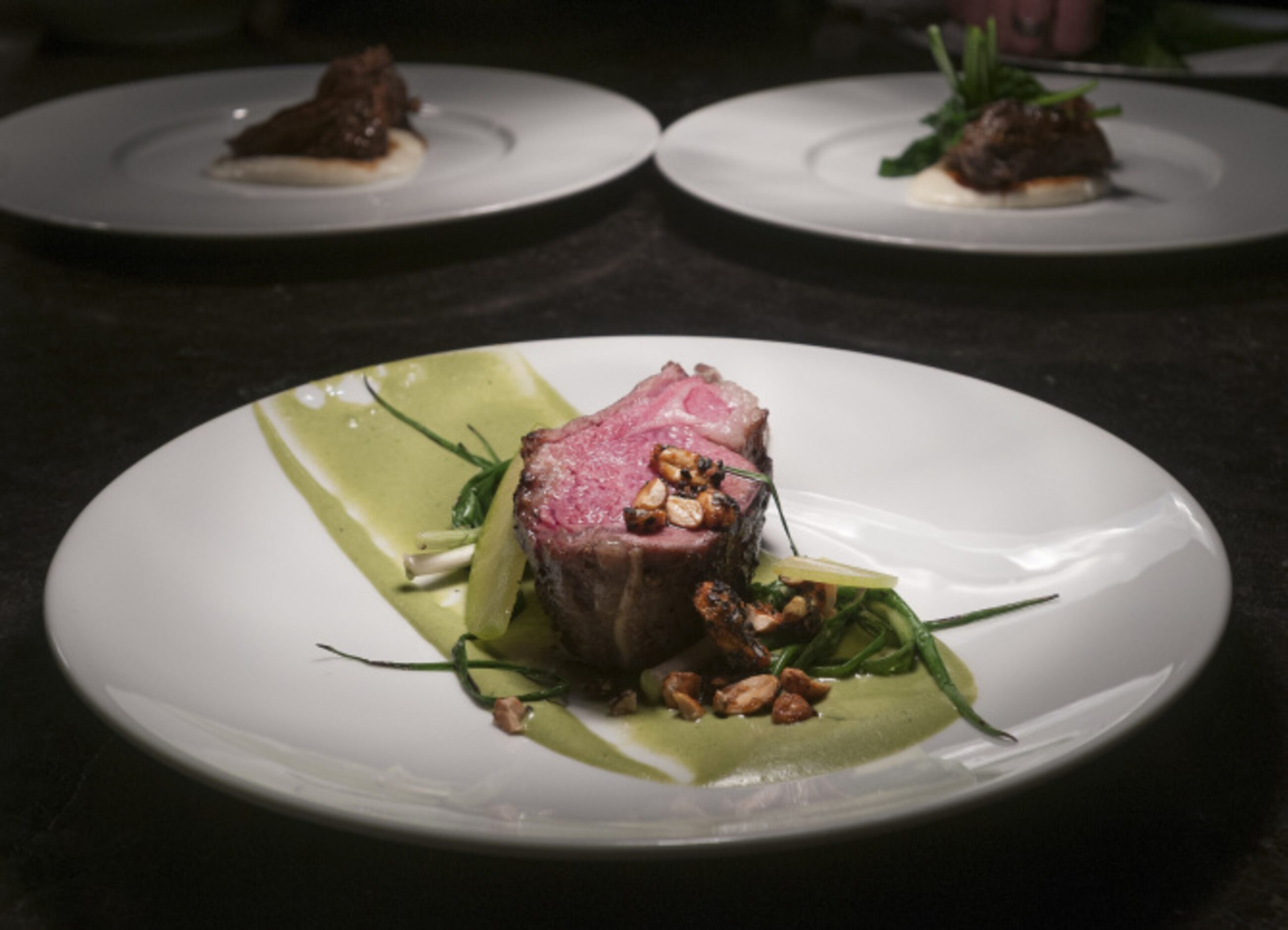 FT33: Matt McCallister's lamb duo pairs a rosy rack with braised leg. It's served with...