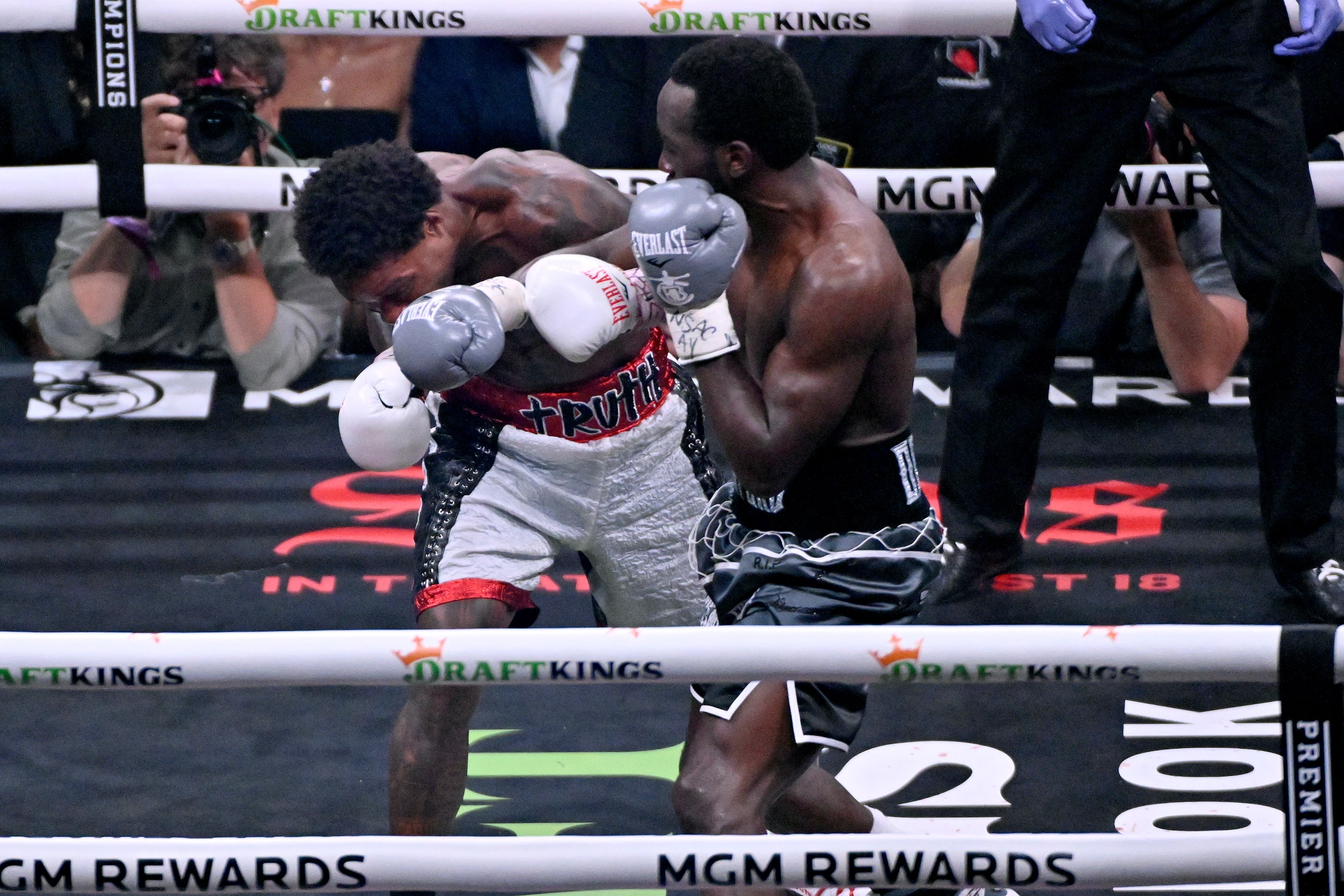 Errol Spence Jr., left, and Terence Crawford fight during their undisputed welterweight...