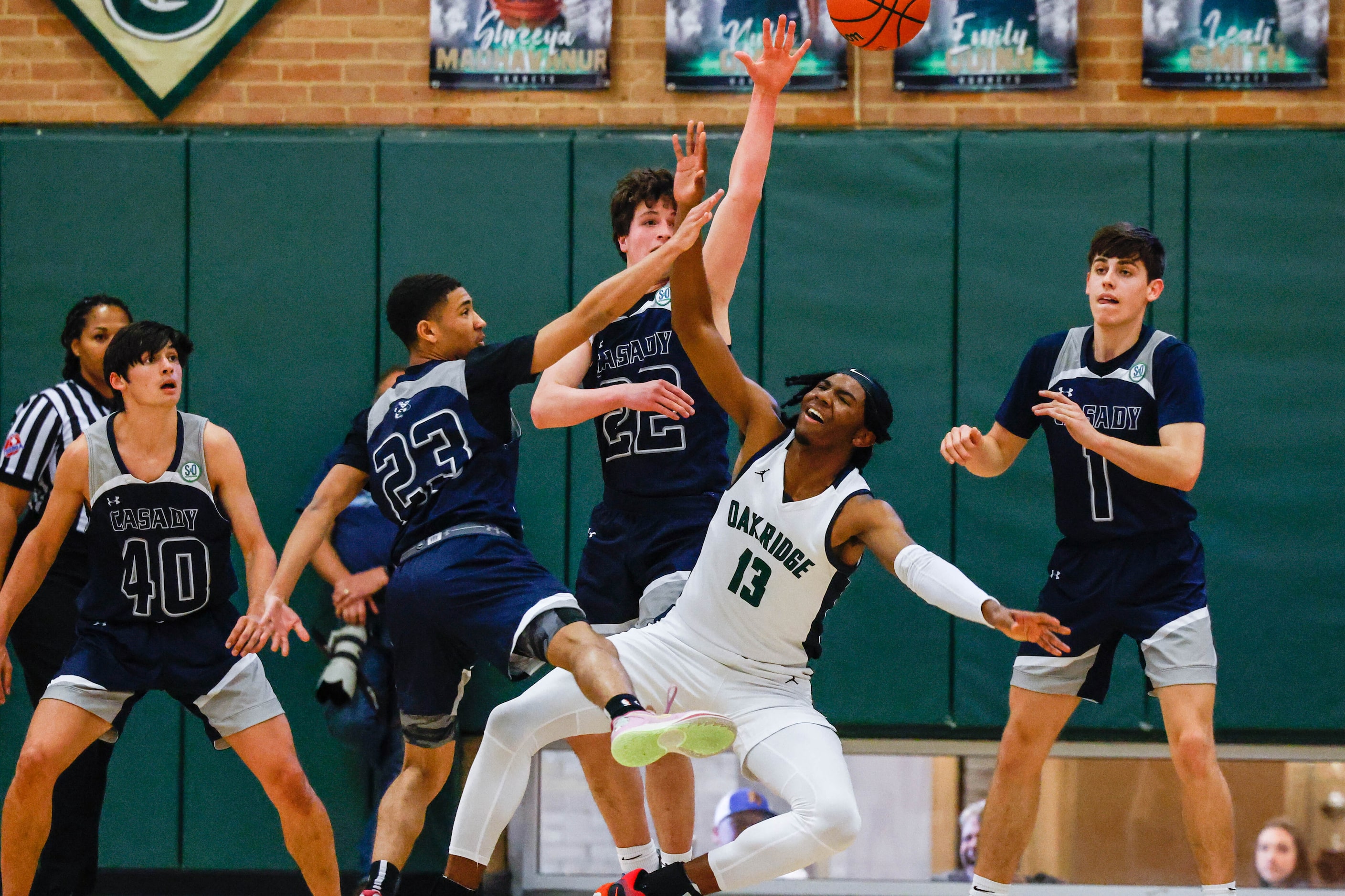 Oakridge Owls' Mitchell Holmes (13) misses a shot from Casady Cyclones' Jack Morgan (40)...