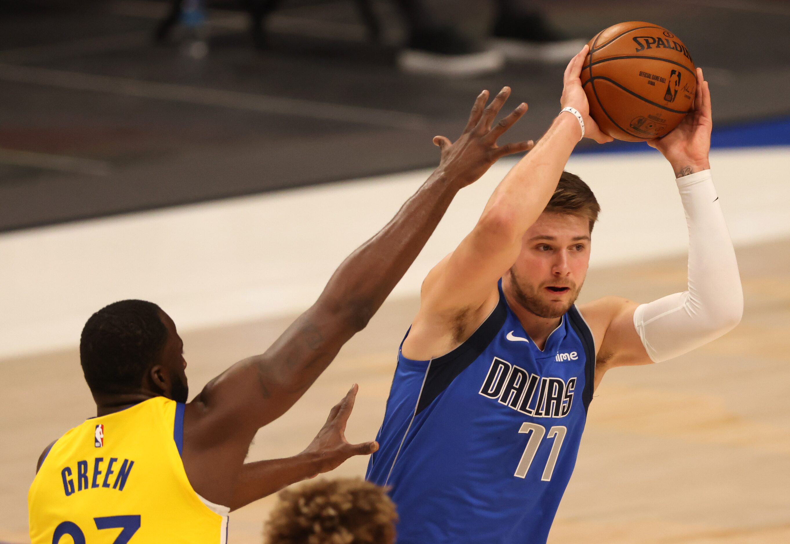 Dallas Mavericks guard Luka Doncic (77) looks to pass asGolden State Warriors forward...