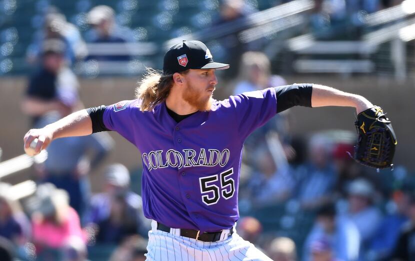 SCOTTSDALE, AZ - FEBRUARY 27:  Jon Gray #55 of the Colorado Rockies delivers a first inning...