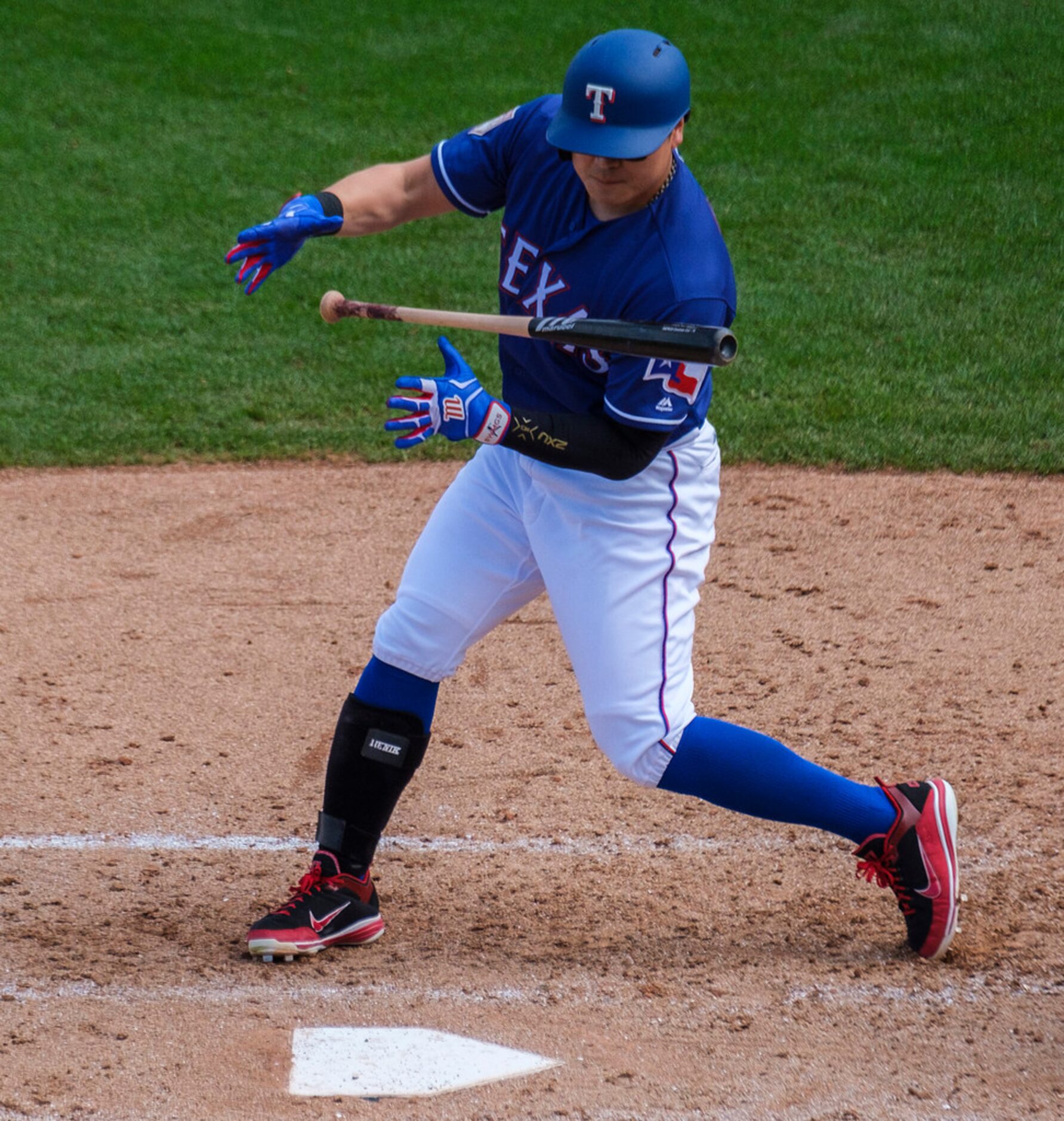 Texas Rangers outfielder Shin-Soo Choo loses his bat as he hits during the fifth inning of a...