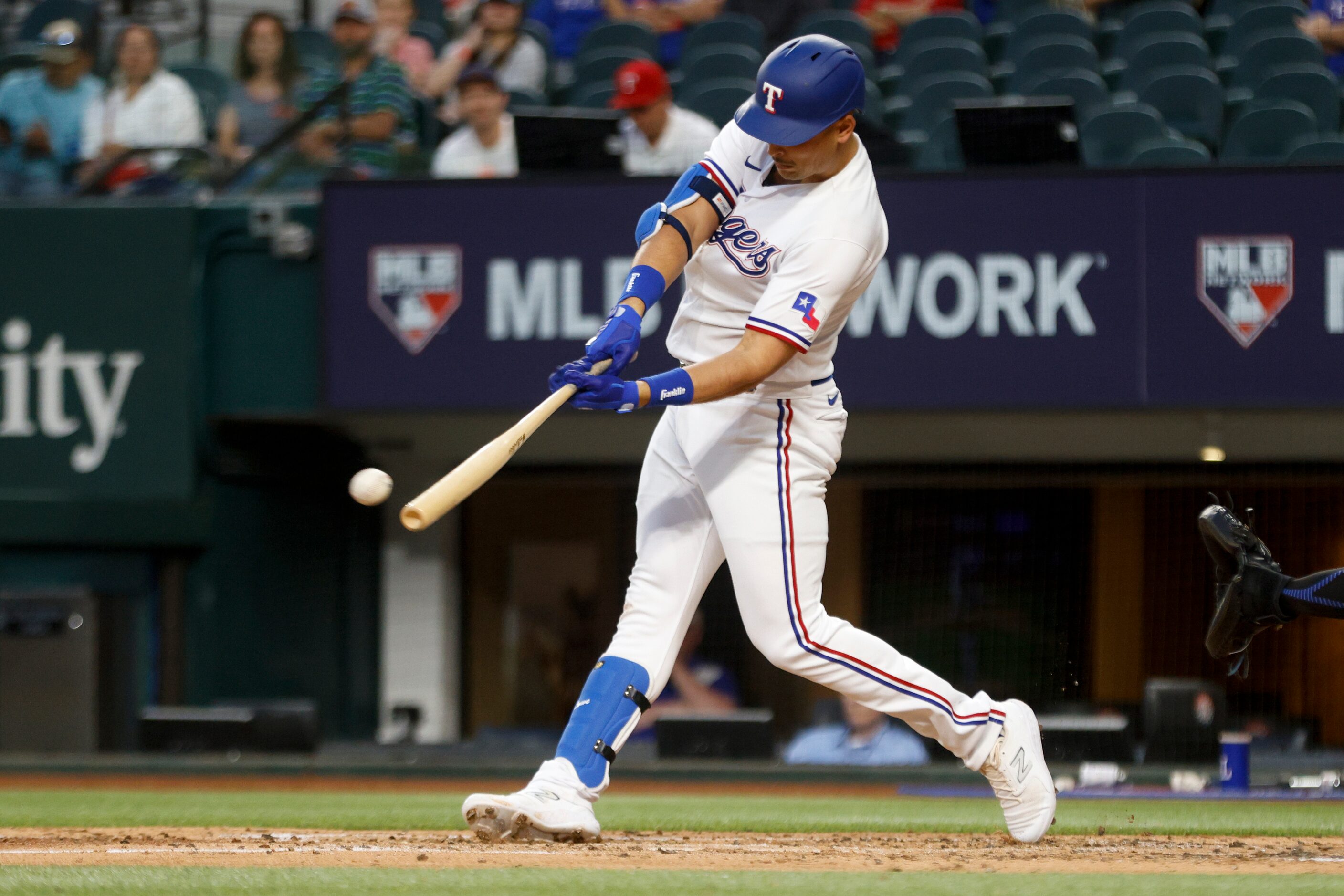 Texas Rangers first baseman Nathaniel Lowe (30) doubles to left field during the third...