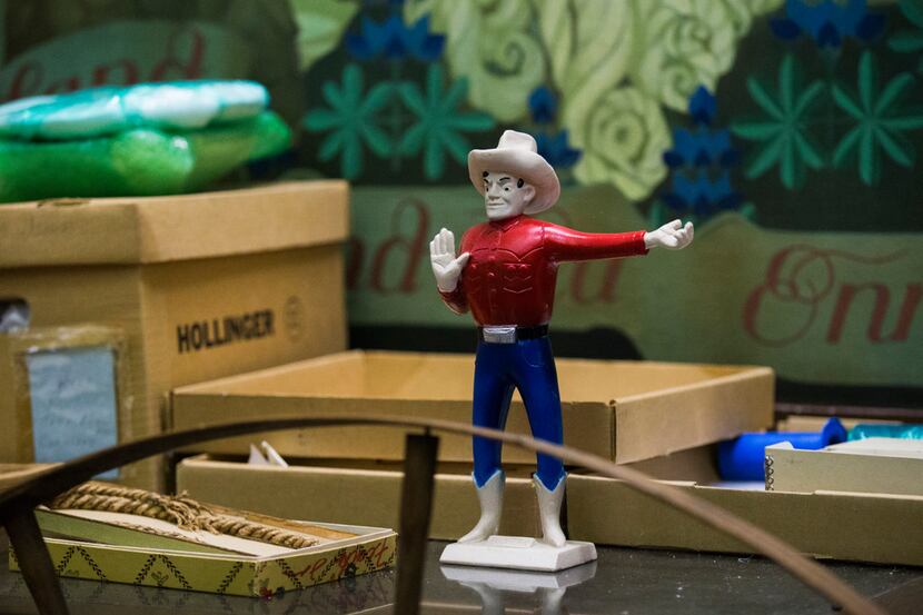 A souvenir Big Tex stands among other display items stored in the West Texas room inside the...