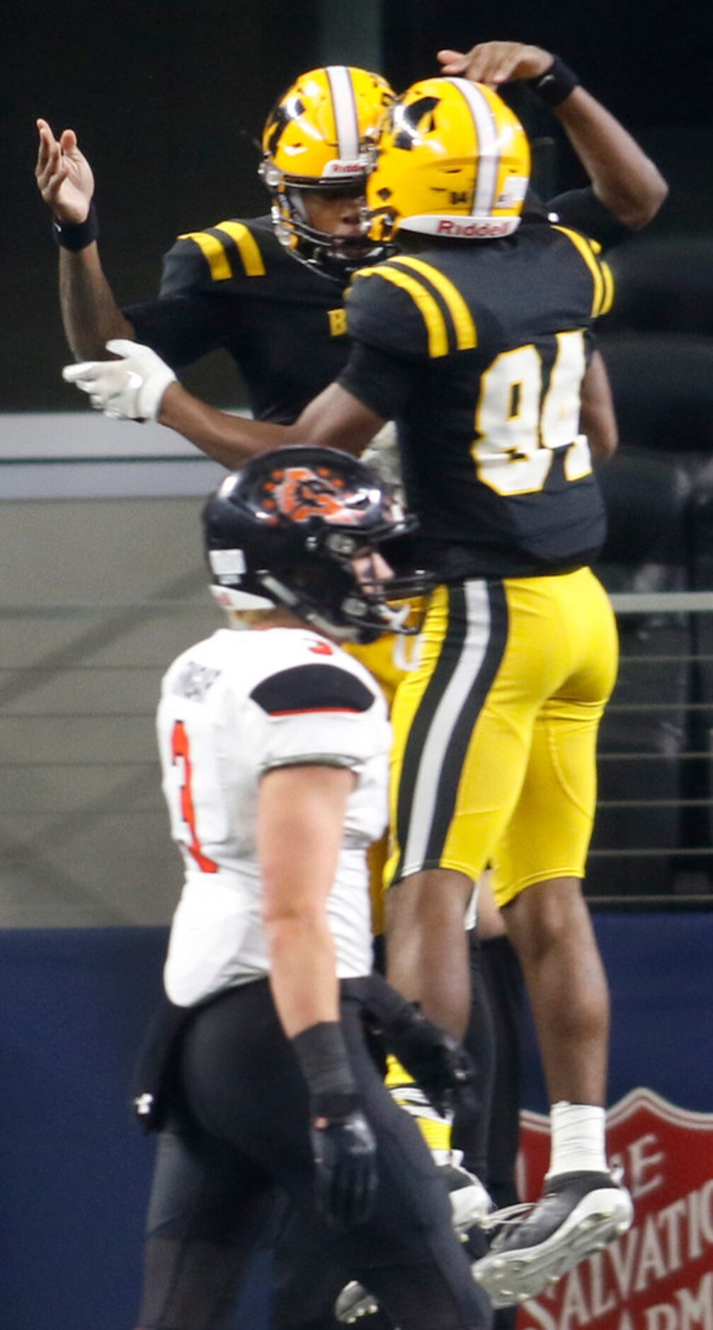 Fort Bend Marshall quarterback Malik Hornsby (1) leaps as he celebrates his first quarter...