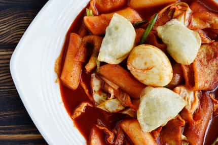 Tteok-bokki, spicy stir fried rice cake with veggies and fish cake, is also on the menu at...