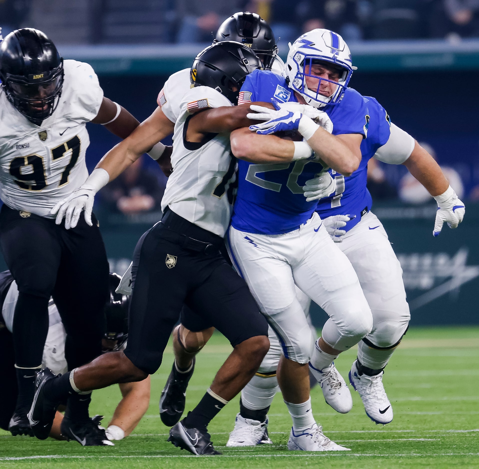 Army Black Knights cornerback Cameron Jones (10) tackles Air Force Falcons running back Brad...