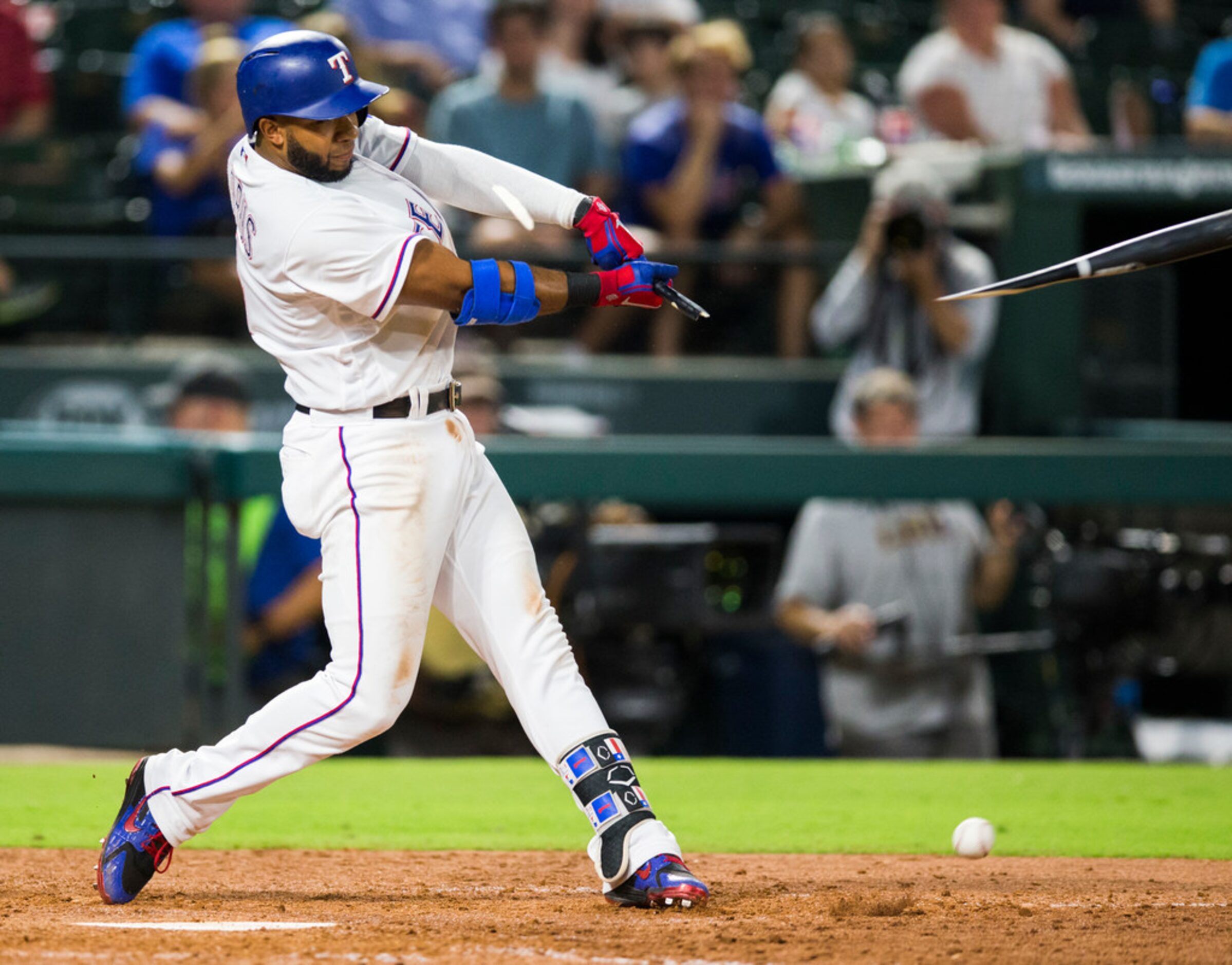 Texas Rangers shortstop Elvis Andrus (1) breaks a bat during the eighth inning of an MLB...