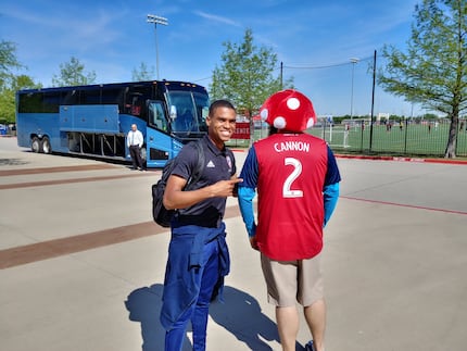 Reggie Cannon poses for a photo with FC Dallas fan Rob Szczepankowski