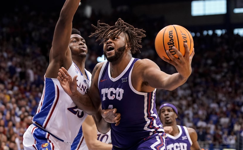 TCU center Eddie Lampkin Jr. (4) works his way inside against Kansas center Ernest Udeh Jr....