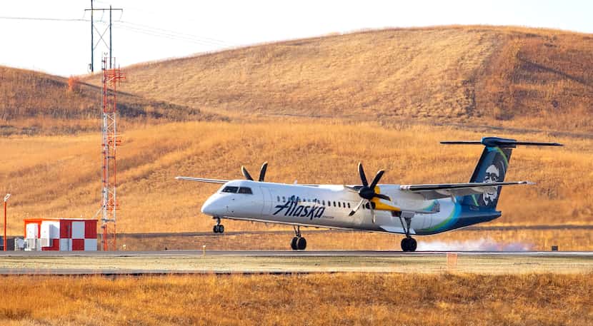 An Alaska Air airplane landed on the new runway before a ribbon-cutting ceremony at the...
