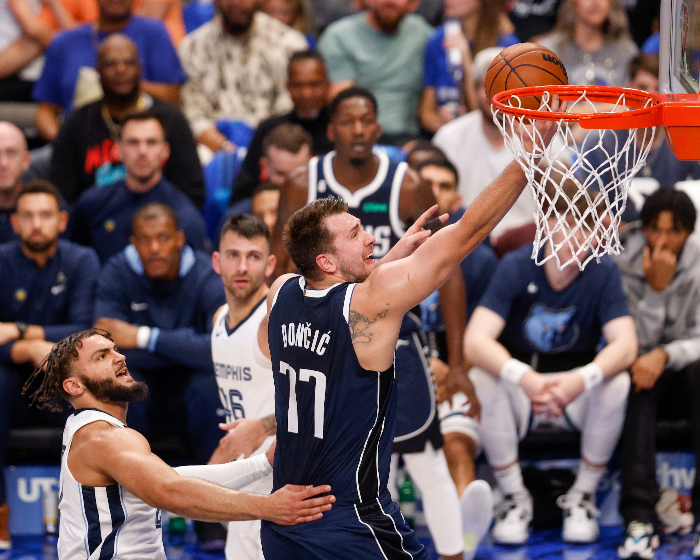 Dallas Mavericks guard Luka Doncic (77) drives past Memphis Grizzlies guard David Roddy (27)...