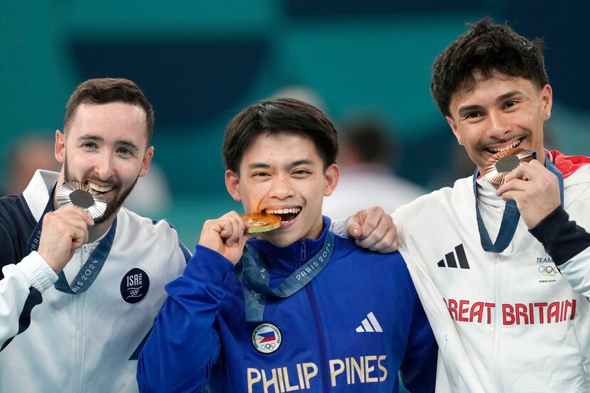 From left to right, silver medalist Artem Dolgopyat, of Israel, gold medalist Carlos Edriel...