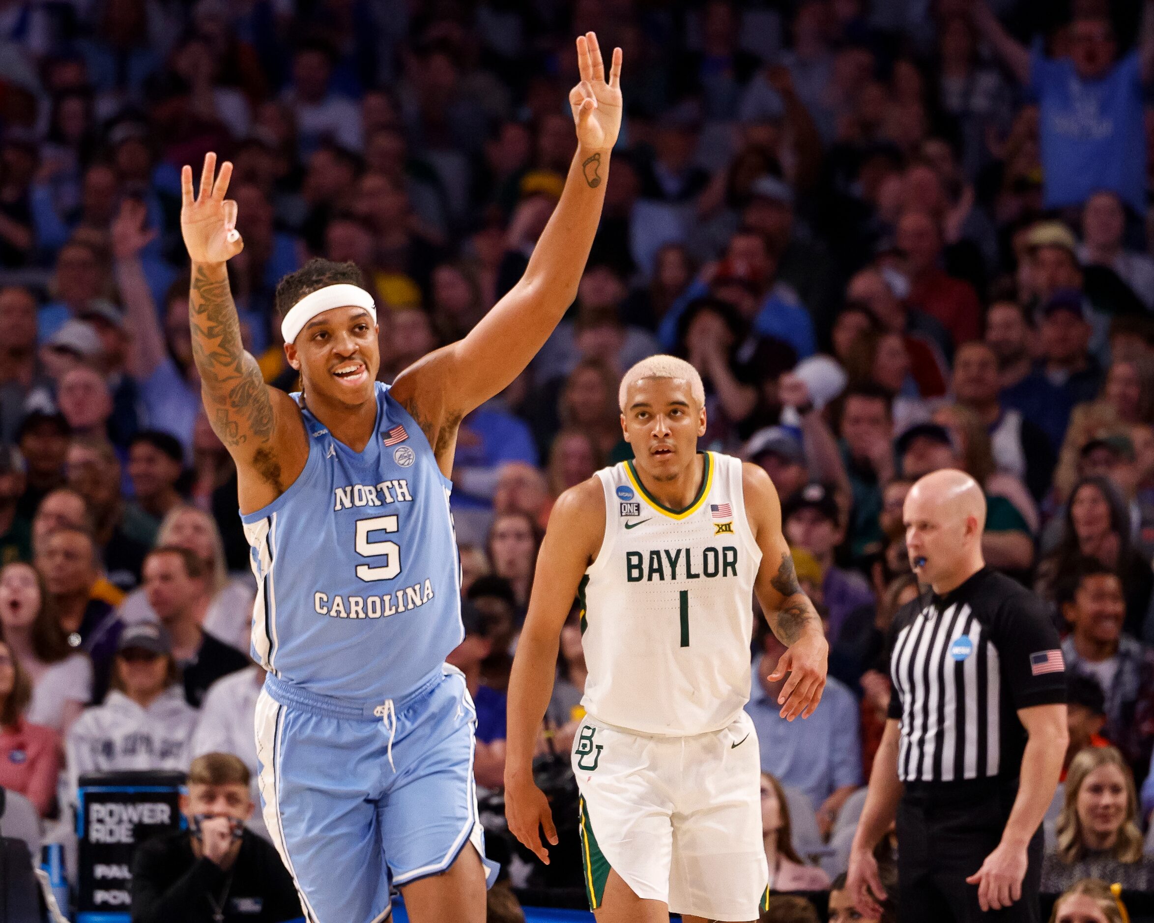 North Carolina Tar Heels forward Armando Bacot (5) celebrates a three-point shot in front of...