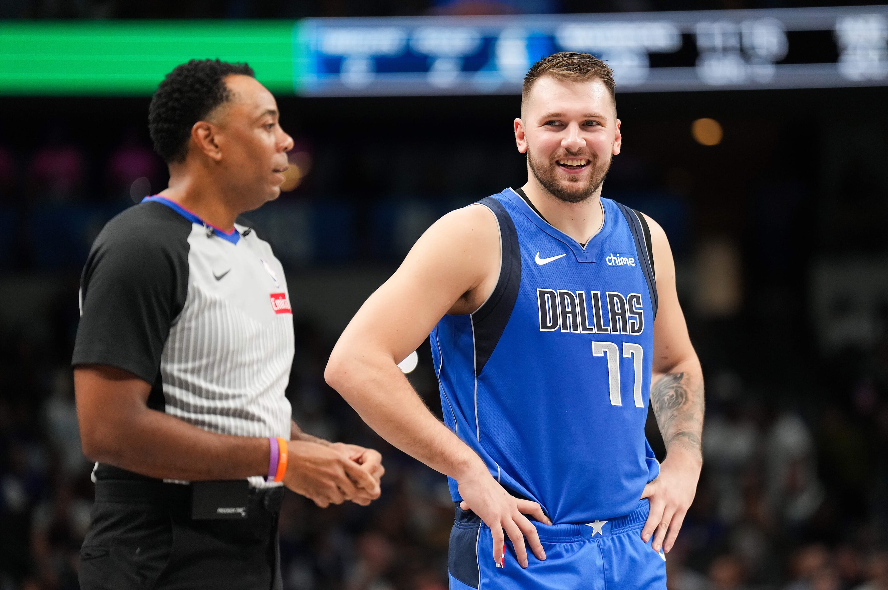 Dallas Mavericks guard Luka Doncic (77) talks with referee Karl Lane during the first half...