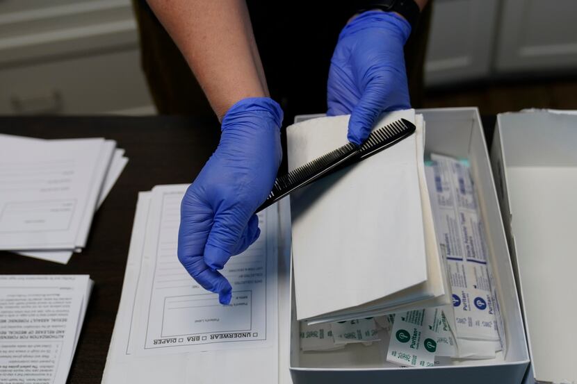 A rape kit is unpacked in an examination room in Austin. More than 14,000 rape crimes have...