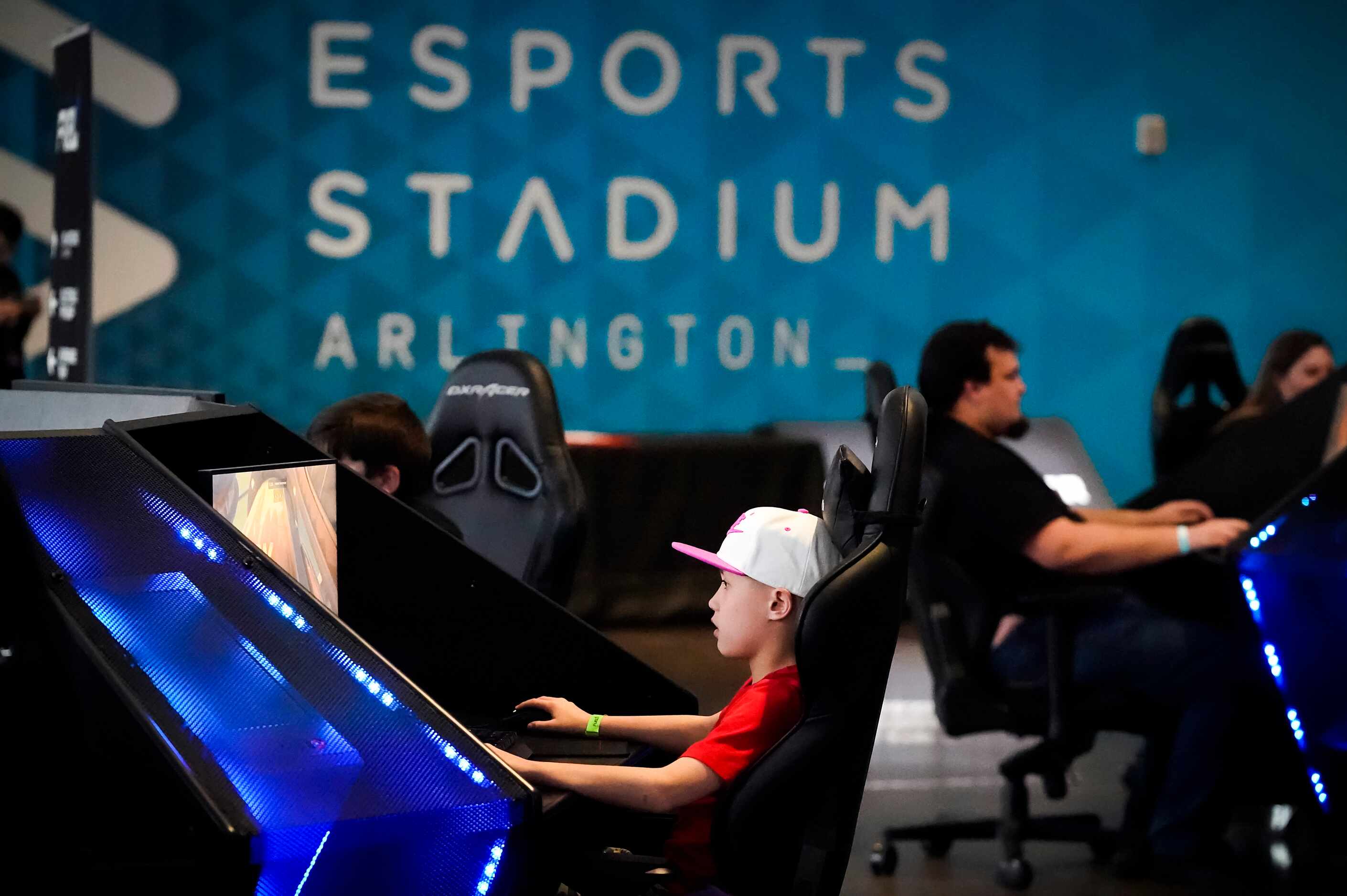 Fans play video games in the Dallas Fuel opening weekend fan festival before a Overwatch...