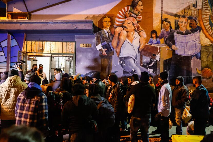 Migrants wait outside the Centro Pastoral Sagrado Corazon for the opportunity to have...