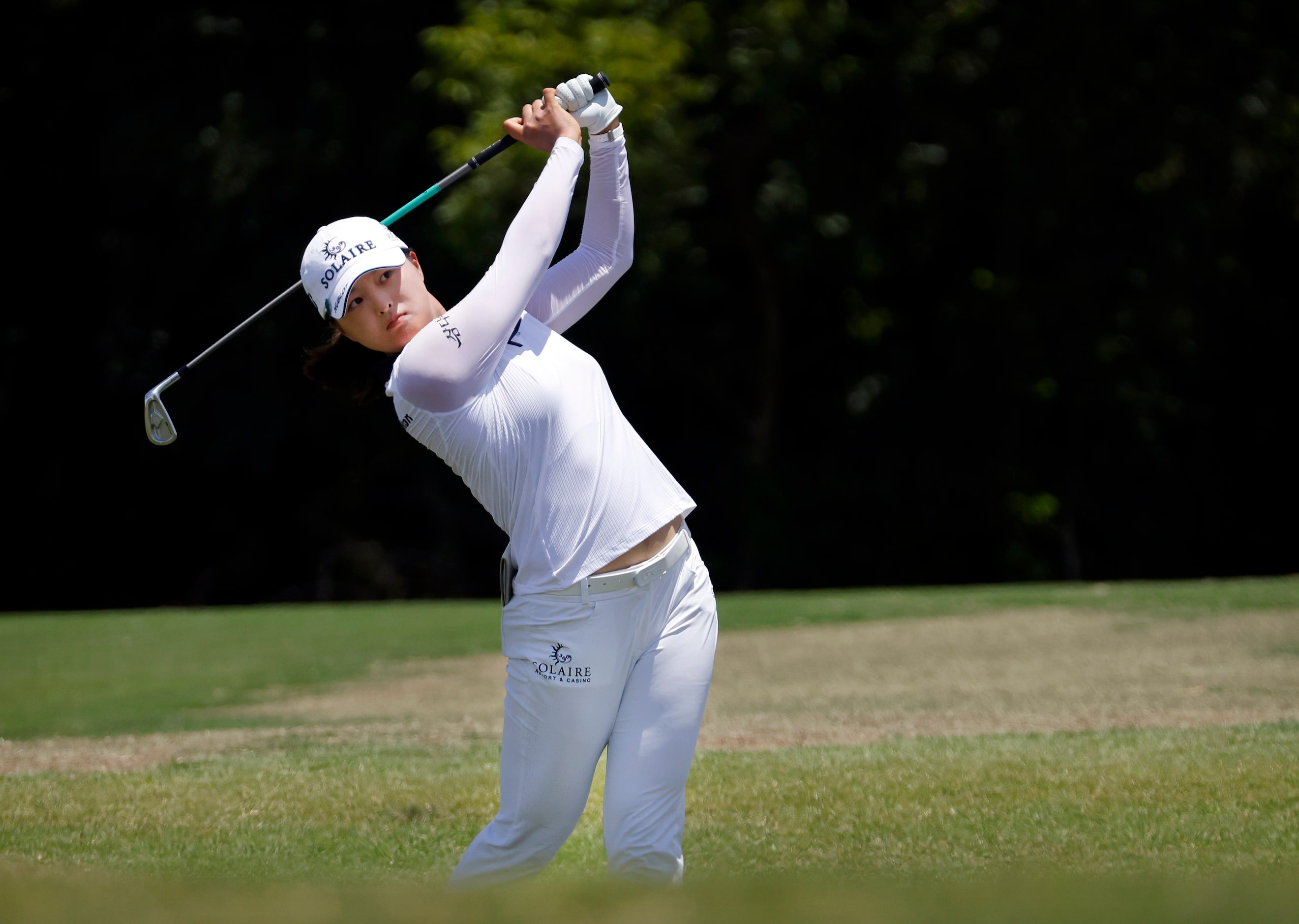 Professional golfer Jin Young Ko hits her approach shot on No. 9 during the opening round of...