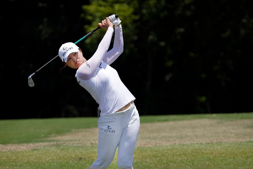 Professional golfer Jin Young Ko hits her approach shot on No. 9 during the opening round of...