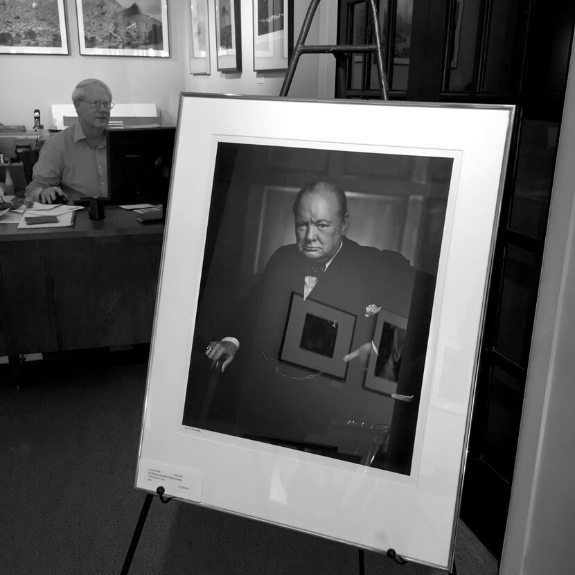  A portrait of Sir Winston Churchill by Yousuf Karsh stands in Afterimage Gallery as owner...
