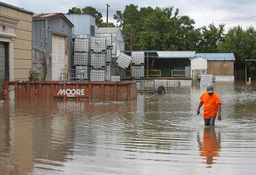  When the Trinity River drowned a business' parking lot just south of downtown at the end of...