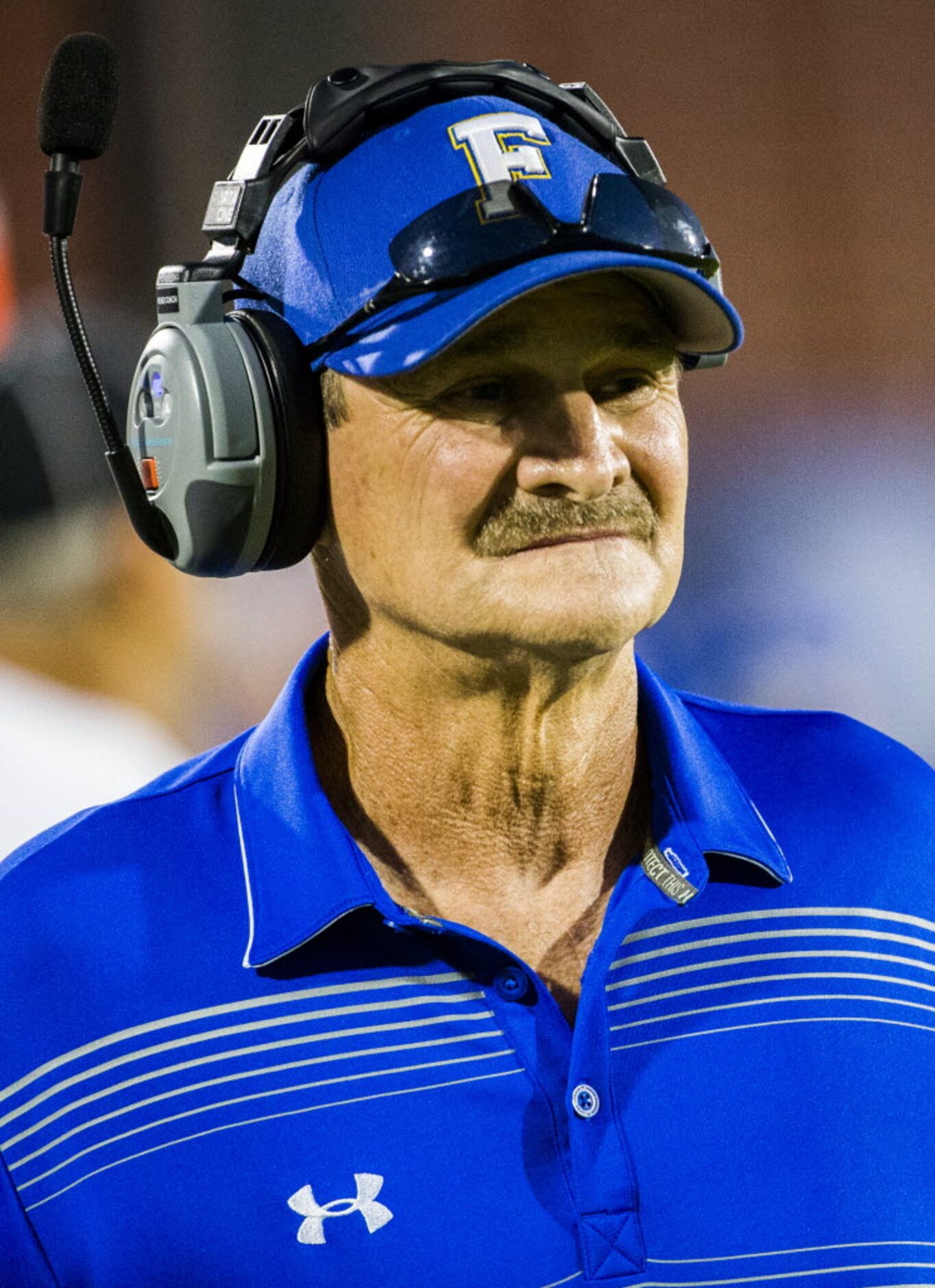 Frisco head coach Vance Gibson watches from the sidelines during the second quarter of their...