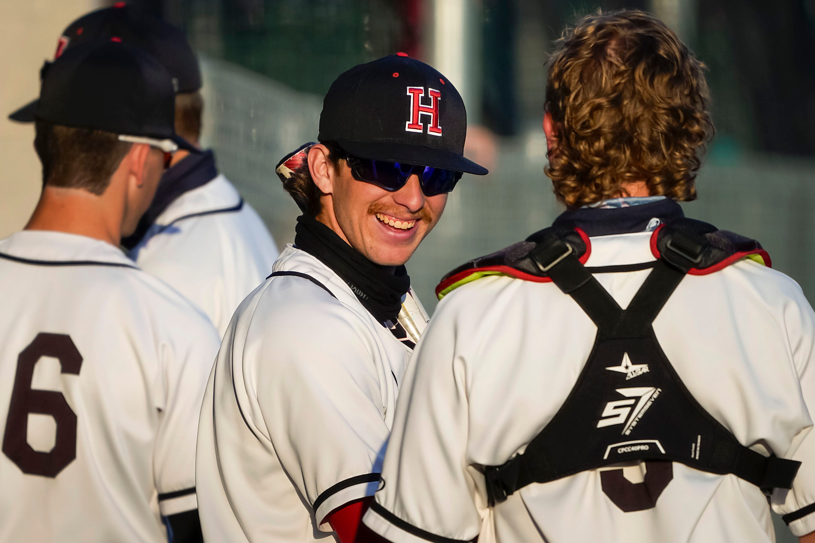 Rockwall-Heath shortstop Karson Krowka (facing) talks with catcher Kevin Bazzell in the...