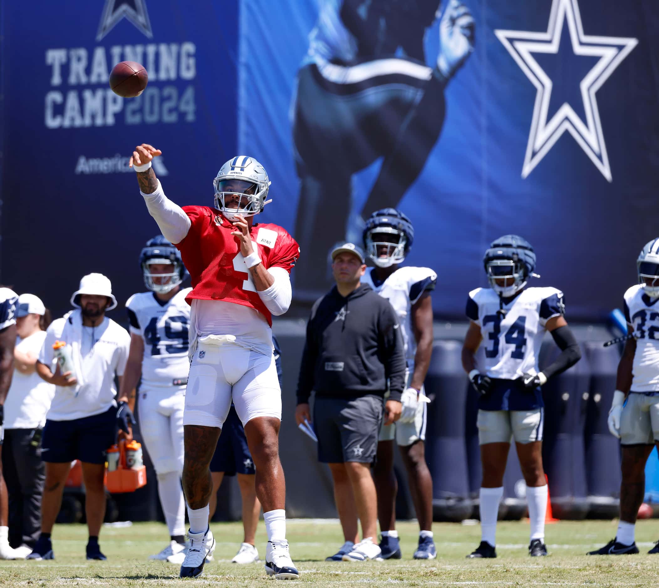 Dallas Cowboys quarterback Dak Prescott (4) tosses a touchdown pass as he threw to receivers...