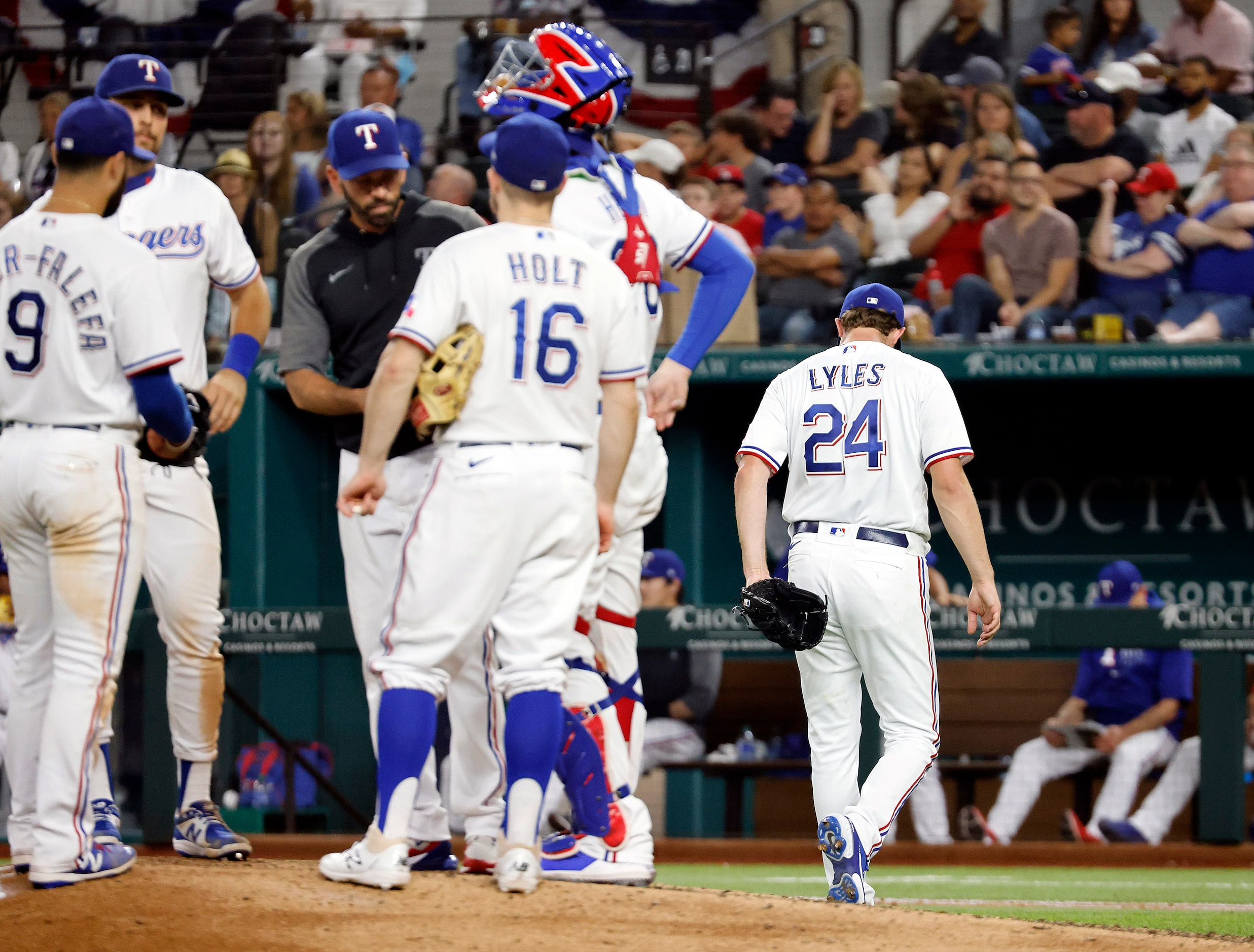 Texas Rangers starting pitcher Jordan Lyles (24) heads for the dugout after being pulled by...