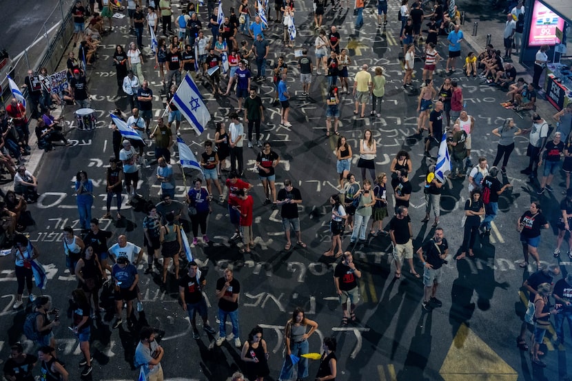 People protest against Prime Minister Benjamin Netanyahu's government and call for the...