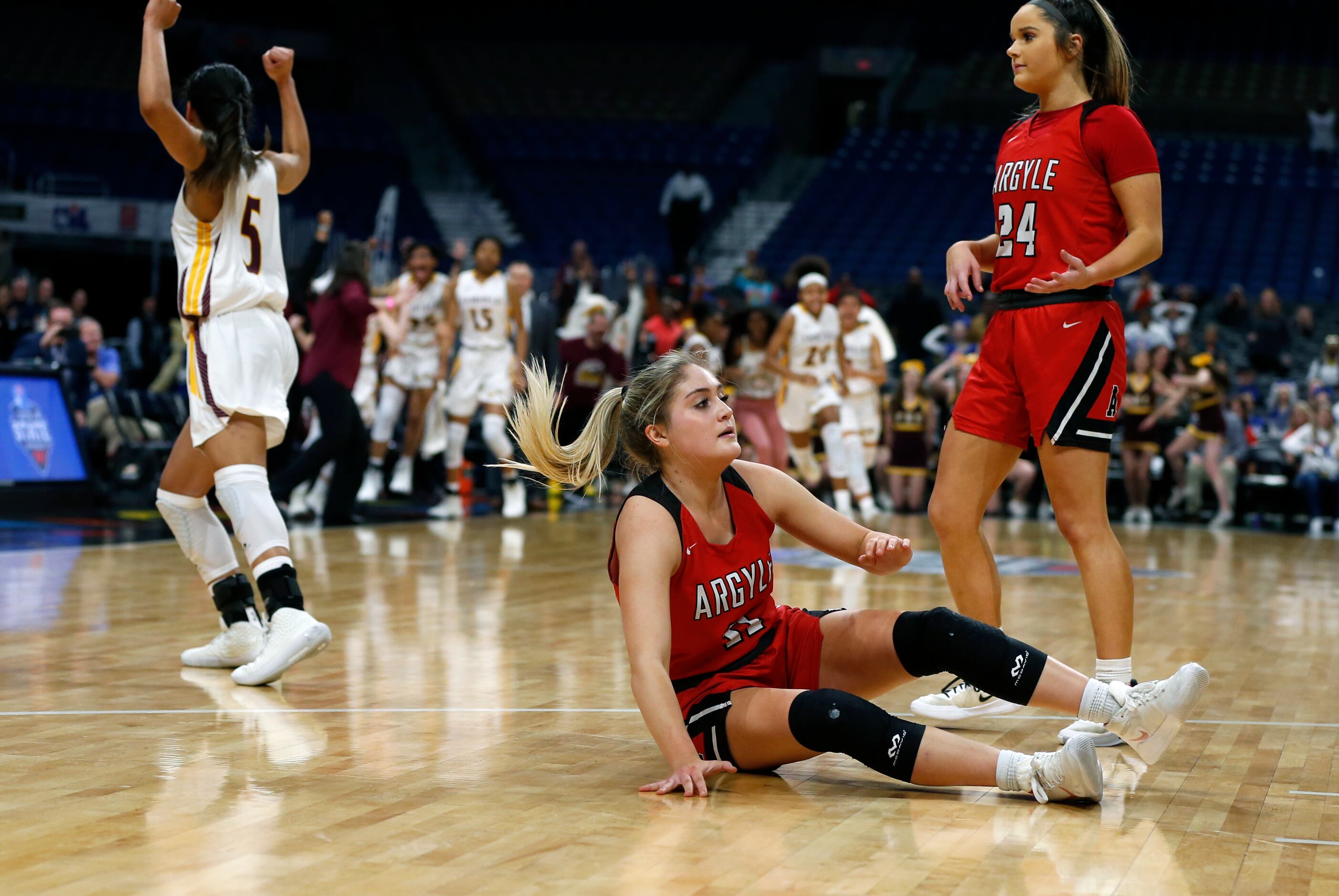Argyle guard Brooklyn Carl #11 reacts at the end of OT in a 4A final on Saturday, March 7,...