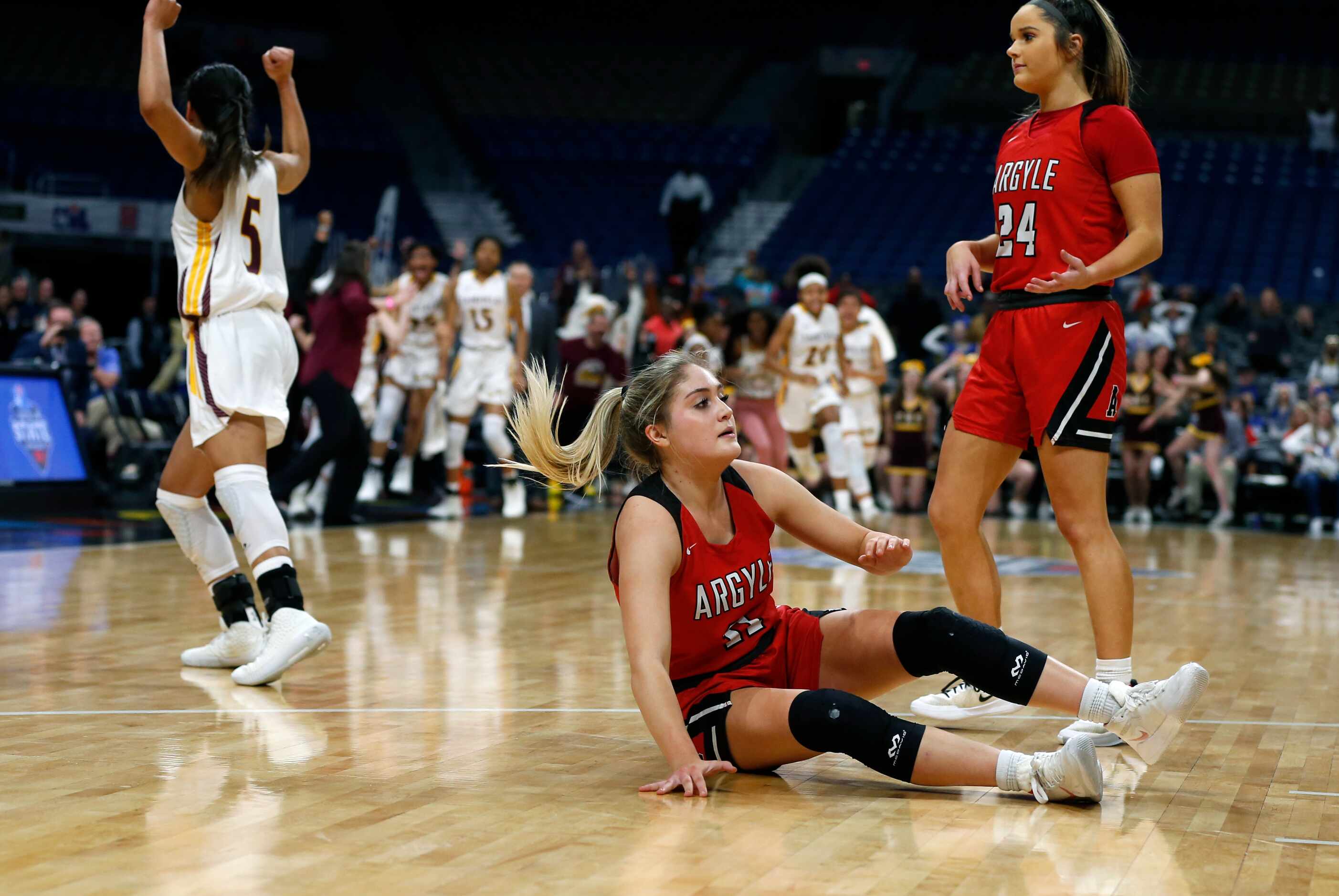 Argyle guard Brooklyn Carl #11 reacts at the end of OT in a 4A final on Saturday, March 7,...