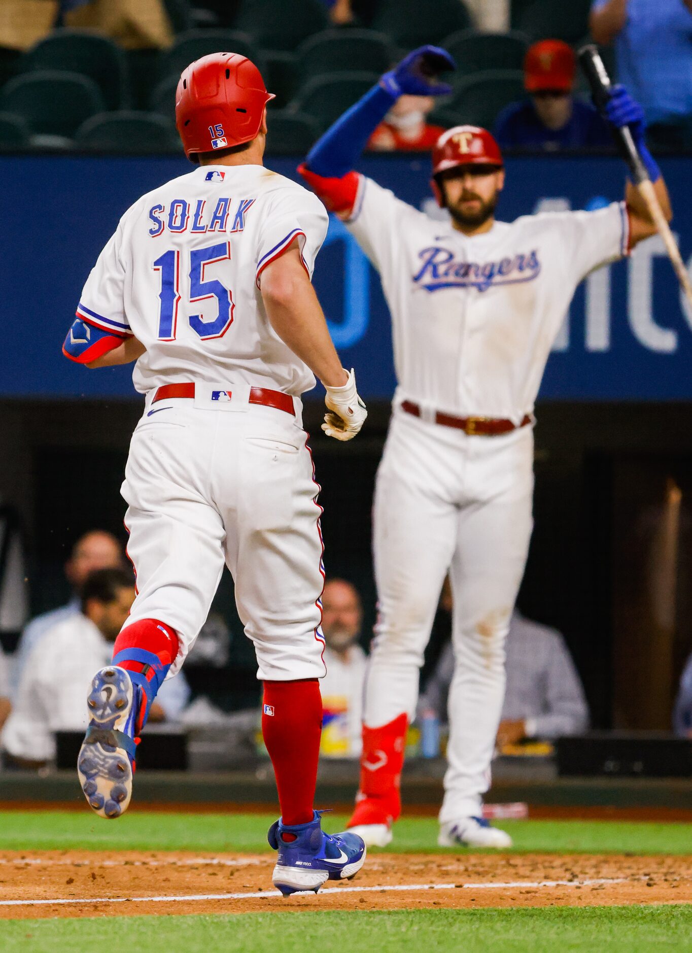 Texas Rangers center fielder Joey Gallo (13) cheers on Texas Rangers second baseman Nick...