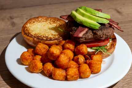 The ostrich burger with duck bacon and avocado at FireBird Fowl looks a whole lot like a...