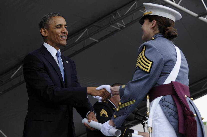 President Barack Obama presents Calla Glavin her United States Military Academy diploma...