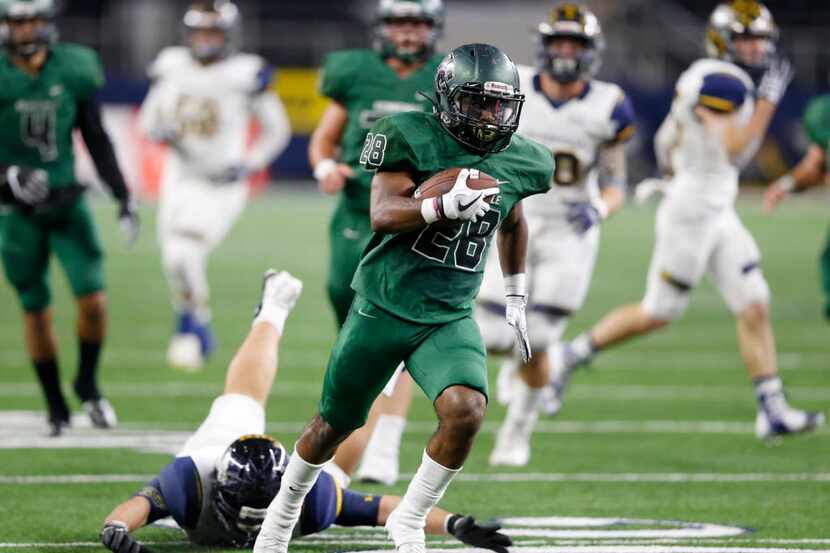 Kennedale's DJ Kirven (28) on his way to the end zone to score a touchdown in a game against...