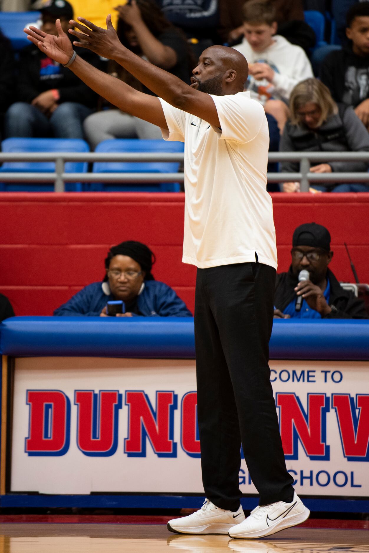 Kimball Head Coach Nick Smith urges his players to play defense during Kimball's...